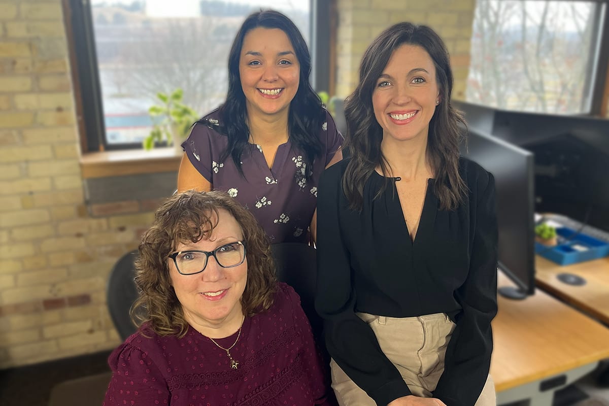 Four eSafety team members at a desk